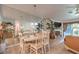 Dining area with a mirrored wall, a chandelier, and comfortable seating for entertaining at 460 Strawflower Rd, Las Vegas, NV 89107