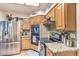 Featuring stainless steel appliances, this kitchen has granite countertops and plenty of cabinet storage at 460 Strawflower Rd, Las Vegas, NV 89107