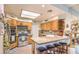 Well-lit kitchen featuring wood cabinets, granite countertops, and stainless steel appliances at 460 Strawflower Rd, Las Vegas, NV 89107