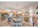 Eat-in kitchen featuring an island with seating, stainless steel appliances, and wood cabinetry at 460 Strawflower Rd, Las Vegas, NV 89107