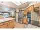 This open kitchen features stainless steel appliances, granite counters and access to the living room at 460 Strawflower Rd, Las Vegas, NV 89107