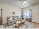 Relax in this cozy living room which features a decorative rug, couch and coffee table at 460 Strawflower Rd, Las Vegas, NV 89107