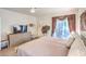 This main bedroom has an ensuite bathroom and hardwood floors at 460 Strawflower Rd, Las Vegas, NV 89107
