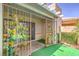 Exterior view of a cozy patio area with garden decor and greenspace at 460 Strawflower Rd, Las Vegas, NV 89107