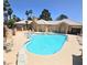 Beautiful community pool with ample seating and palm trees, creating a relaxing oasis for residents and guests at 460 Strawflower Rd, Las Vegas, NV 89107