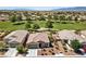 Aerial view of single story home showcases desert landscaping and neighborhood at 5375 E La Campana Dr, Pahrump, NV 89061