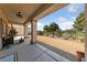 Covered back patio offers an ideal space for outdoor seating and relaxing at 5375 E La Campana Dr, Pahrump, NV 89061