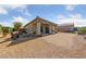Spacious gravel backyard featuring a covered patio area perfect for entertaining at 5375 E La Campana Dr, Pahrump, NV 89061