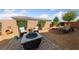 Intimate backyard area with a fire pit, seating and attractive landscaping at 5375 E La Campana Dr, Pahrump, NV 89061
