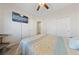 Well-lit bedroom featuring a sliding door closet and access to the bathroom at 5375 E La Campana Dr, Pahrump, NV 89061
