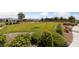 Community green space with lush landscaping, walking paths, and common seating areas at 5375 E La Campana Dr, Pahrump, NV 89061
