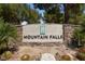 Mountain Falls community sign with lush landscaping at 5375 E La Campana Dr, Pahrump, NV 89061
