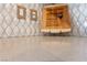Close up of kitchen countertop with tile backsplash, outlet and wooden cutting board detail at 5375 E La Campana Dr, Pahrump, NV 89061