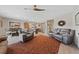 Open-concept living room and kitchen, showcasing tile floors and comfortable seating area at 5375 E La Campana Dr, Pahrump, NV 89061