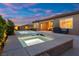 Inviting backyard features a sparkling pool and spa for relaxing evenings at home at 6192 Lautman Ridge Ct, Las Vegas, NV 89141