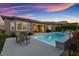 Captivating backyard with a pool and outdoor seating, perfect for relaxation, entertainment, and enjoying the serene atmosphere at 6192 Lautman Ridge Ct, Las Vegas, NV 89141