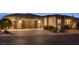 Beautiful home featuring a spacious three-car garage, well-maintained landscaping, and a paved driveway at 6192 Lautman Ridge Ct, Las Vegas, NV 89141