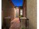 Inviting front entrance featuring a charming brick pathway and landscaped planters near the front door at 6192 Lautman Ridge Ct, Las Vegas, NV 89141