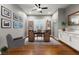 Bright home office with a built-in desk, shelving, ample natural light, and a comfortable seating area at 6192 Lautman Ridge Ct, Las Vegas, NV 89141