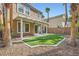 Backyard featuring a covered patio and manicured lawn area at 62 Myrtle Springs Ct, Las Vegas, NV 89148
