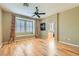 A bedroom bathed in natural light with hardwood floors and a sitting area at 62 Myrtle Springs Ct, Las Vegas, NV 89148