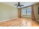 This bedroom features hardwood floors, neutral walls, and natural light at 62 Myrtle Springs Ct, Las Vegas, NV 89148