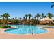 Community pool with waterpark features, palm trees and lounge chairs at 62 Myrtle Springs Ct, Las Vegas, NV 89148