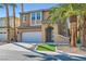 Charming two-story home boasts a well-maintained front yard, two car garage, and desert landscaping at 62 Myrtle Springs Ct, Las Vegas, NV 89148