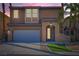 Two-story home with well-maintained lawn and neutral exterior at 62 Myrtle Springs Ct, Las Vegas, NV 89148