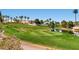 Scenic golf course featuring lush greenery, water features, and views of the community at 62 Myrtle Springs Ct, Las Vegas, NV 89148