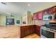A well-designed kitchen flows into the living area with a breakfast bar at 62 Myrtle Springs Ct, Las Vegas, NV 89148