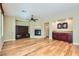 The living room has hardwood floors, fireplace, and built-in cabinets at 62 Myrtle Springs Ct, Las Vegas, NV 89148