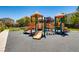 Well-maintained community playground featuring slides and play structures for outdoor fun at 62 Myrtle Springs Ct, Las Vegas, NV 89148