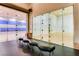 Modern indoor racquetball court featuring glass walls and ample lighting at 62 Myrtle Springs Ct, Las Vegas, NV 89148