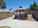 Wooden gazebo in the backyard, offering a shaded outdoor space for relaxation and entertaining at 6215 Darby Ave, Las Vegas, NV 89146