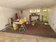 Spacious basement area with a carpet and storage containers at 6215 Darby Ave, Las Vegas, NV 89146