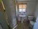 Small bathroom with shower stall, sink and toilet at 6215 Darby Ave, Las Vegas, NV 89146