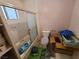 Bathroom with a shower and bathtub combo, a toilet, and neutral decor at 6215 Darby Ave, Las Vegas, NV 89146
