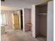 Bedroom with neutral walls, carpeted flooring, built-in desk, and closet at 6215 Darby Ave, Las Vegas, NV 89146
