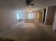 Bedroom with neutral carpet and walls, featuring a desk, built-in drawers and wardrobe at 6215 Darby Ave, Las Vegas, NV 89146