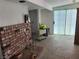 Living room with a brick fireplace and view into another room at 6215 Darby Ave, Las Vegas, NV 89146