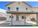 Backyard featuring a covered patio, artificial grass, and desert landscaping at 6420 Rosemount Ave, Las Vegas, NV 89156