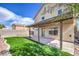 Spacious backyard features artificial turf, a covered patio, and a privacy wall, perfect for outdoor entertaining at 6420 Rosemount Ave, Las Vegas, NV 89156