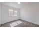 Well lit Bedroom featuring neutral carpet, white walls, and a window at 6420 Rosemount Ave, Las Vegas, NV 89156