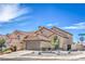 Attractive two-story home with a tile roof, arched entryway, and low maintenance landscaping at 6420 Rosemount Ave, Las Vegas, NV 89156