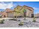 Charming home with a well-manicured front yard, decorative rock landscaping, and a spacious driveway at 6420 Rosemount Ave, Las Vegas, NV 89156
