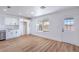 Bright kitchen area with stainless appliances and wood-look floors at 6420 Rosemount Ave, Las Vegas, NV 89156