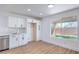 Bright kitchen with stainless appliances and a view to the backyard at 6420 Rosemount Ave, Las Vegas, NV 89156