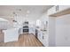 Bright kitchen with stainless appliances and white cabinetry at 6420 Rosemount Ave, Las Vegas, NV 89156