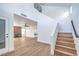 Bright living room with wood floors, staircase and fireplace at 6420 Rosemount Ave, Las Vegas, NV 89156